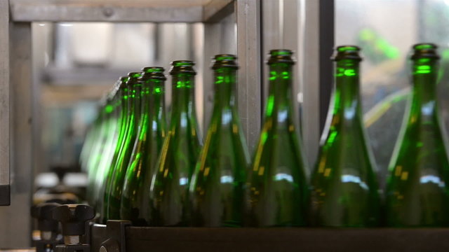 Many bottles on conveyor belt