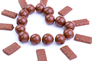 Chocolate candies on a white background.