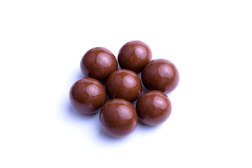 Chocolate candies on a white background.
