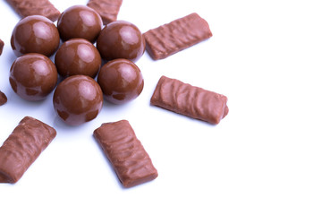 Chocolate candies on a white background.