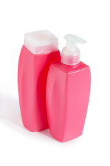 two pink plastic bottles