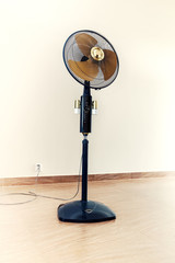 Large modern electric fan in empty room