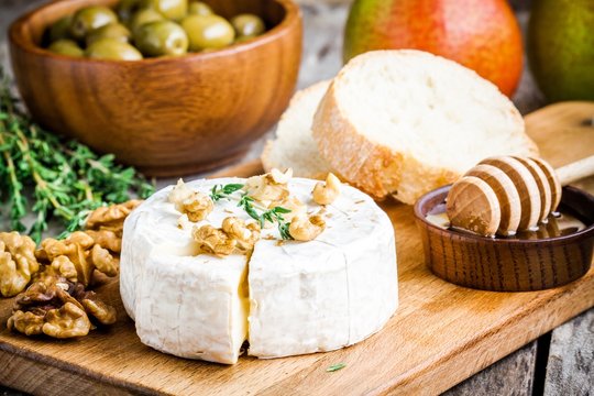 Camembert cheese with walnuts,  honey and baguette