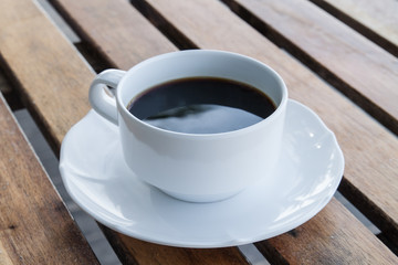 Coffee cup on wooden background