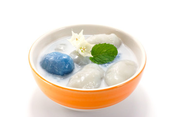 Thai desserts stuffed with coconut and nuts. In coconut milk.