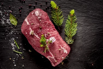 Plexiglas foto achterwand Raw Beef Roast Seasoned with Fresh Herbs © exclusive-design