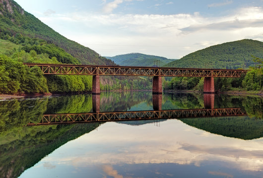 Lake with Mountain and railroad bridge