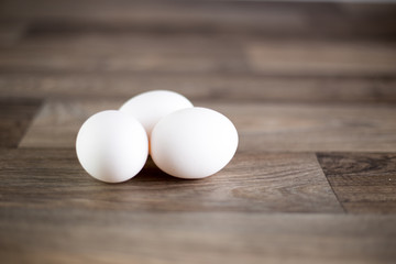 Fototapeta na wymiar Eggs on wooden table