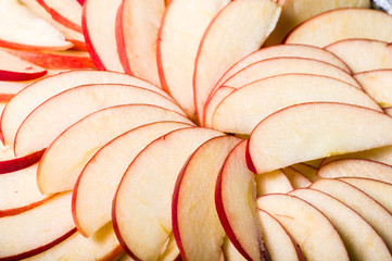 Apple slices arranged in skillet