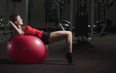 Young athletic girl in the gym