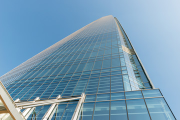 Skyscraper's wall in bright sunny evening