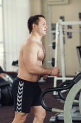 Fototapeta na wymiar Athlete on the treadmill