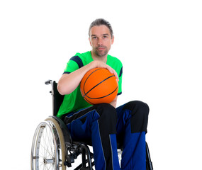 disabled man in a wheelchair is doing sport with ball