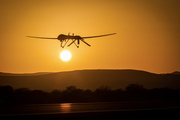 Fototapeta na wymiar An unmanned drone low pass in sunset