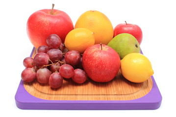 Naklejka na ściany i meble Fresh natural fruits on cutting board