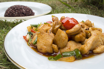 Thai food,stir fired chicken with cashew nuts and rice berry