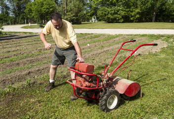 Organic Farmer Starting A Rear Tine Tiller