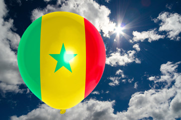 balloon with flag of senegal on sky