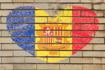 heart shape flag of andorra on brick wall