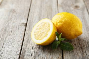 Lemons on grey wooden background