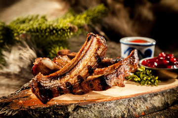 BBQ Boar Spare Ribs Served on Rustic Wood Plank