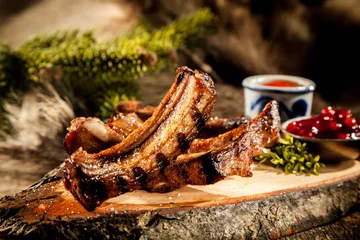 Fotobehang Grill / Barbecue BBQ Boar Spare Ribs Served on Rustic Wood Plank