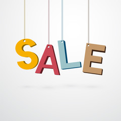 Pastel sale sign hanging on a thread