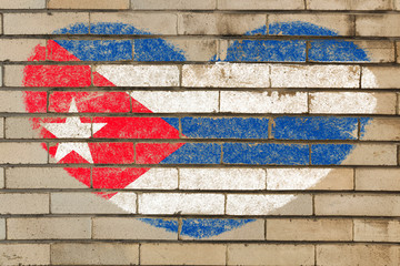 heart shape flag of Cuba on brick wall