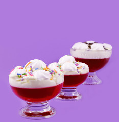 Cups cream and strawberry jelly