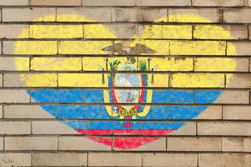 heart shape flag of ecuador on brick wall