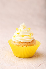 Tasty cupcake on pink background