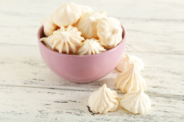 French meringue cookies on white wooden background