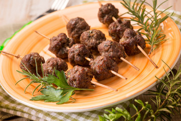 meatballs skewers with herbs, selective focus