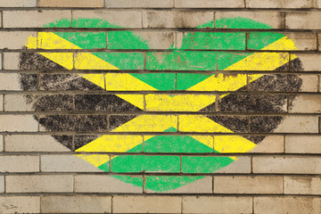heart shape flag of jamaica on brick wall