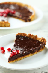 Homemade chocolate tart with pomegranate 
