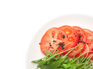 tomato and rocket salad with fermented black pepper