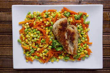 Chicken meat on mixed vegetables