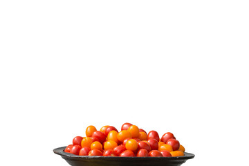 Tomatoes red and yellow on large plate isolated on white.