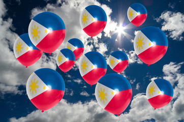 many balloons with philippines flag on sky - Powered by Adobe