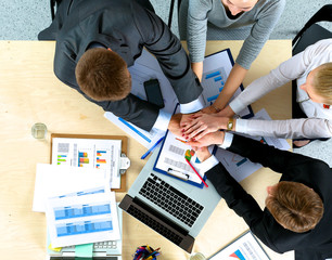 Business team with hands together - teamwork concepts