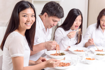 Obraz na płótnie Canvas Asian family having lunch together
