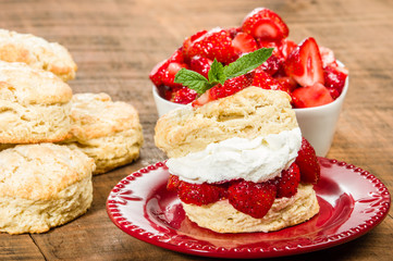 Whipped cream on biscuit with strawberries