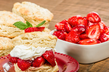 Whipped cream on biscuit with strawberries