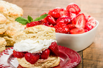 Whipped cream on biscuit with strawberries