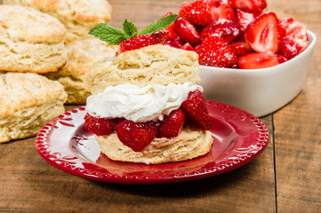 Whipped cream on biscuit with strawberries
