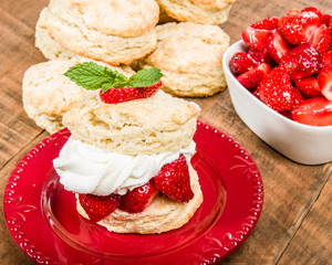 Strawberries and whipped cream on biscuit