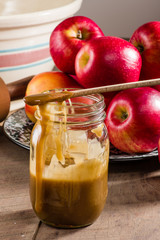 Mason jar of caramel sauce for apple pie
