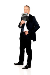 Obraz premium Happy businessman holding a calculator