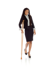 Fototapeta premium Model shot in studio on white injured with crutch
