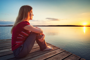 Young woman lookin on sunset